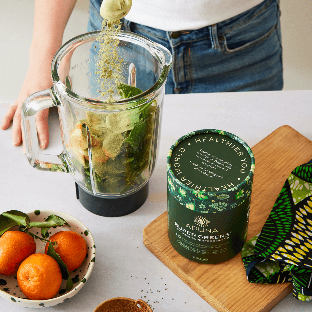 Aduna Super Greens Organic Superfood Blend in juicer