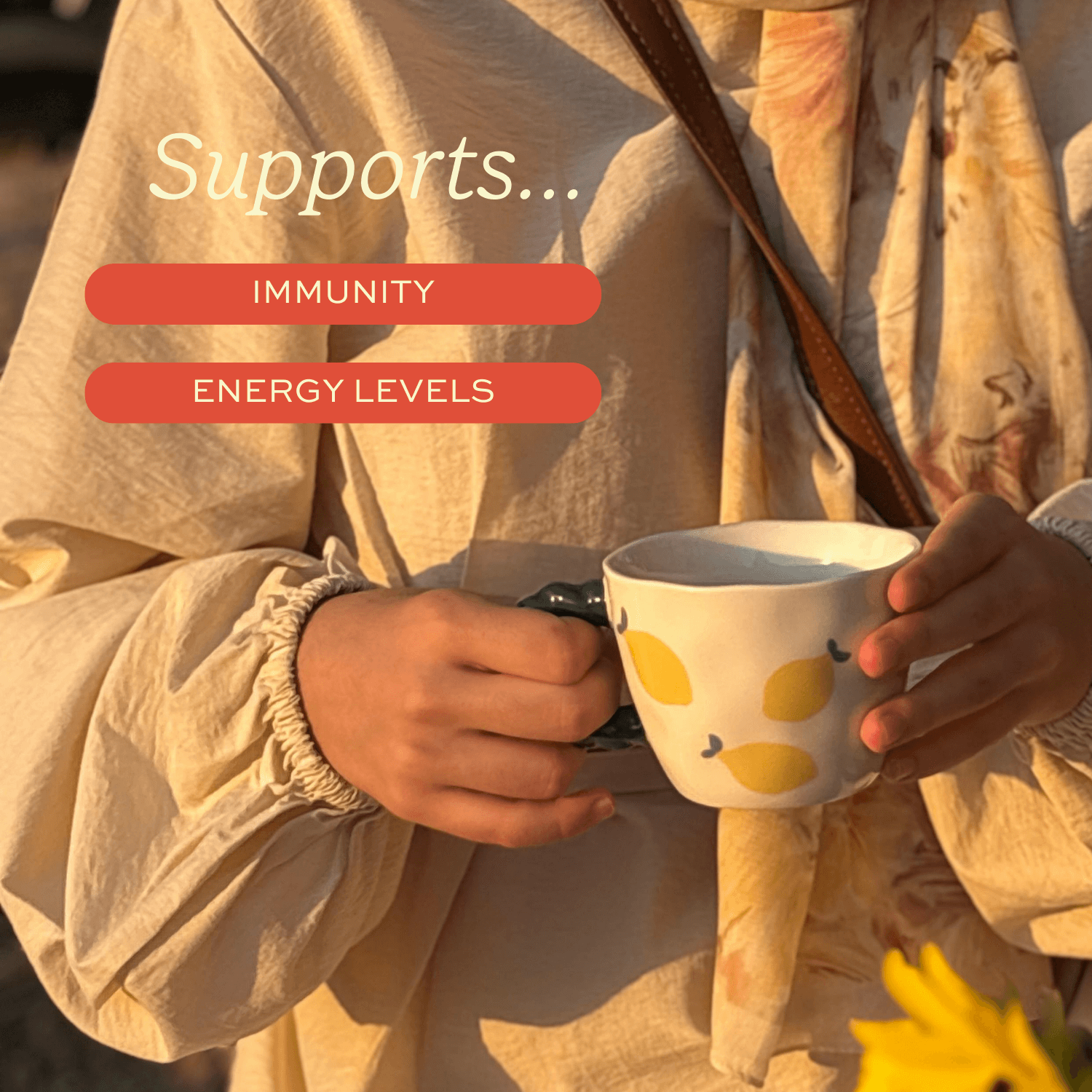 Person holding a mug with lemon designs, surrounded by text about immunity and energy levels.
