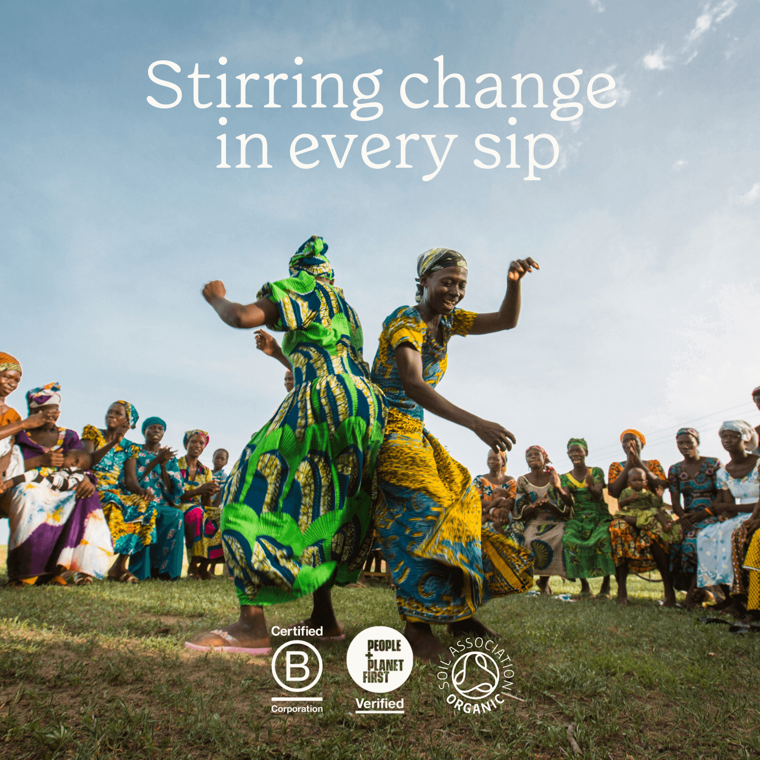 People in colourful traditional attire dancing outdoors with text 'Stirring change in every sip'.