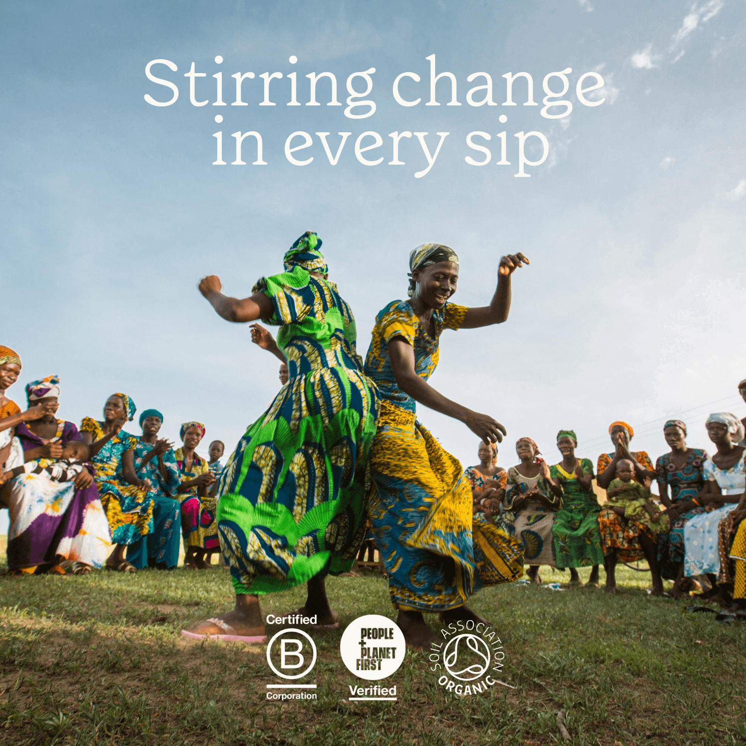 People in colourful traditional attire dancing outdoors with text 'Stirring change in every sip'.